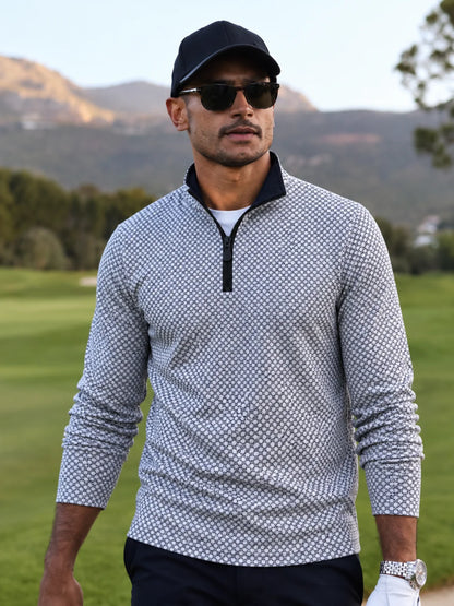Performance-Golfpullover mit schwarz-weißem geometrischem Muster und Viertelreißverschluss